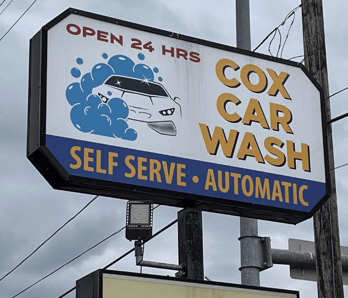 Sign for Cox Car Wash advertising